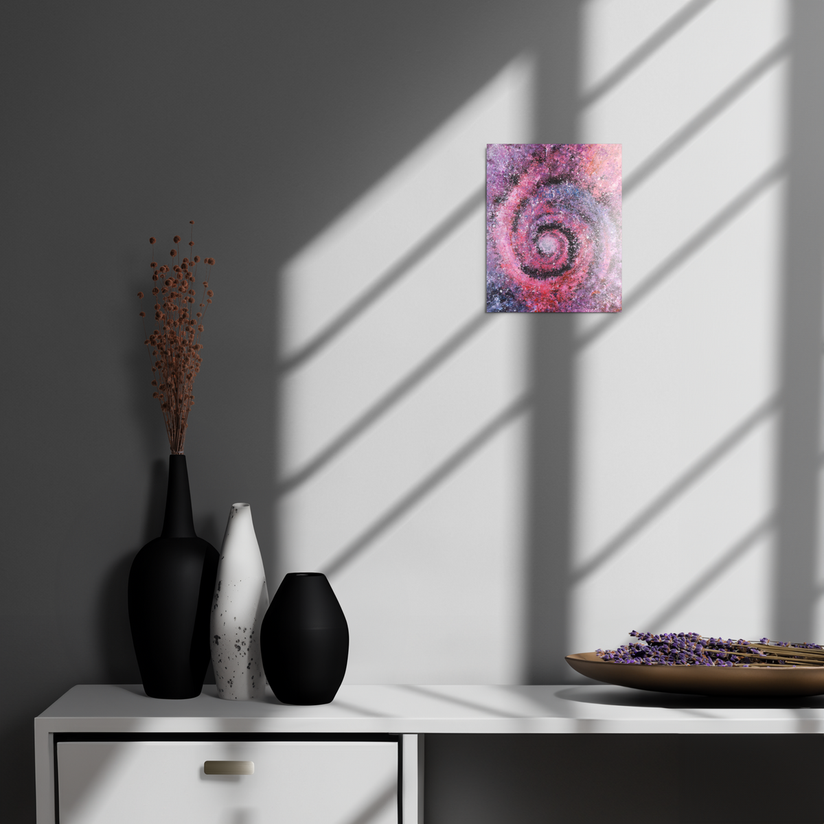 Decorative setup with vases and a painting on a wall showcasing a wormhole vortex