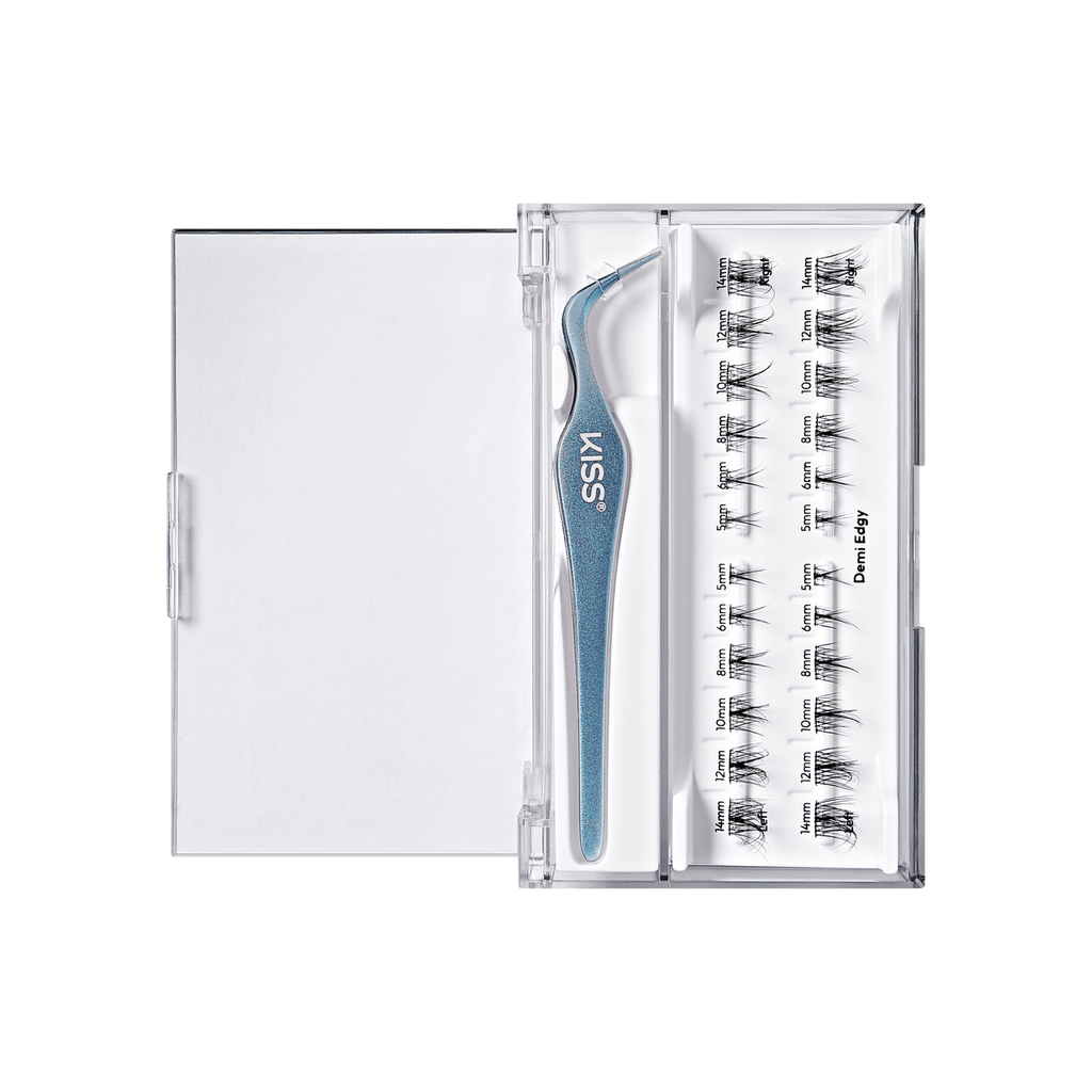 A clear plastic lash kit with a blue glittery KISS brand tweezzer and a tray of black false eyelash clusters on a white background.